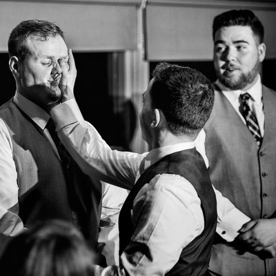 Furry Creek wedding photography groom slapping best man