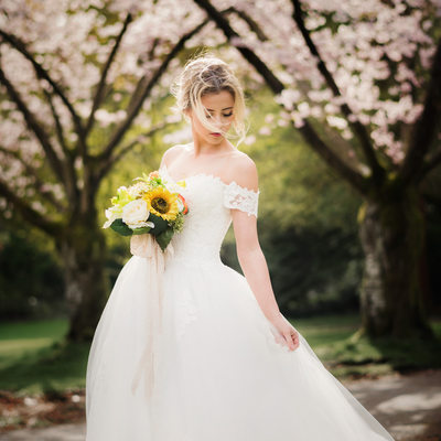 Cherry blossoms wedding bride portrait in white gown