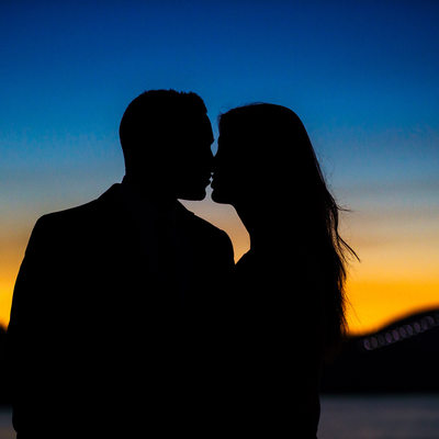 Wedding kiss at sunset is dream come true for brides.