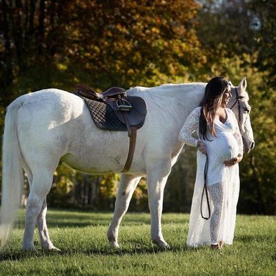 Pregnancy adventure portrait lifestyle shoot with horse