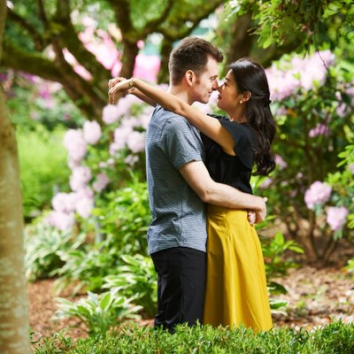 Deer lake engagement pictures in park under big tree