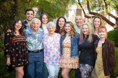 Outdoor backyard Family portrait of Multi-generational family reunion with relatives smiling together in Las Vegas