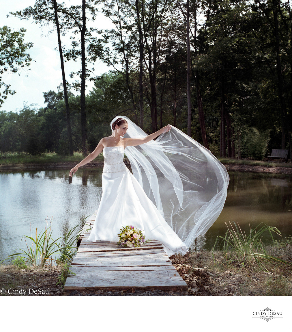 Bride on Dock with Long Veil in Solebury