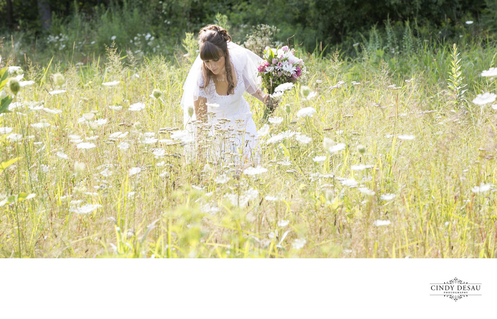 Boho Bride Picks Wildflowers on Her Wedding Day Photo