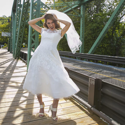 Playful Bride in the Wind on Centre Bridge Wedding Photo