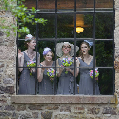 Bridesmaids Watch From Window Candid Moment in New Hope