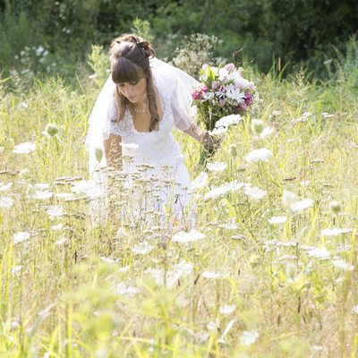 Boho Bride Picks Wildflowers on Her Wedding Day Photo