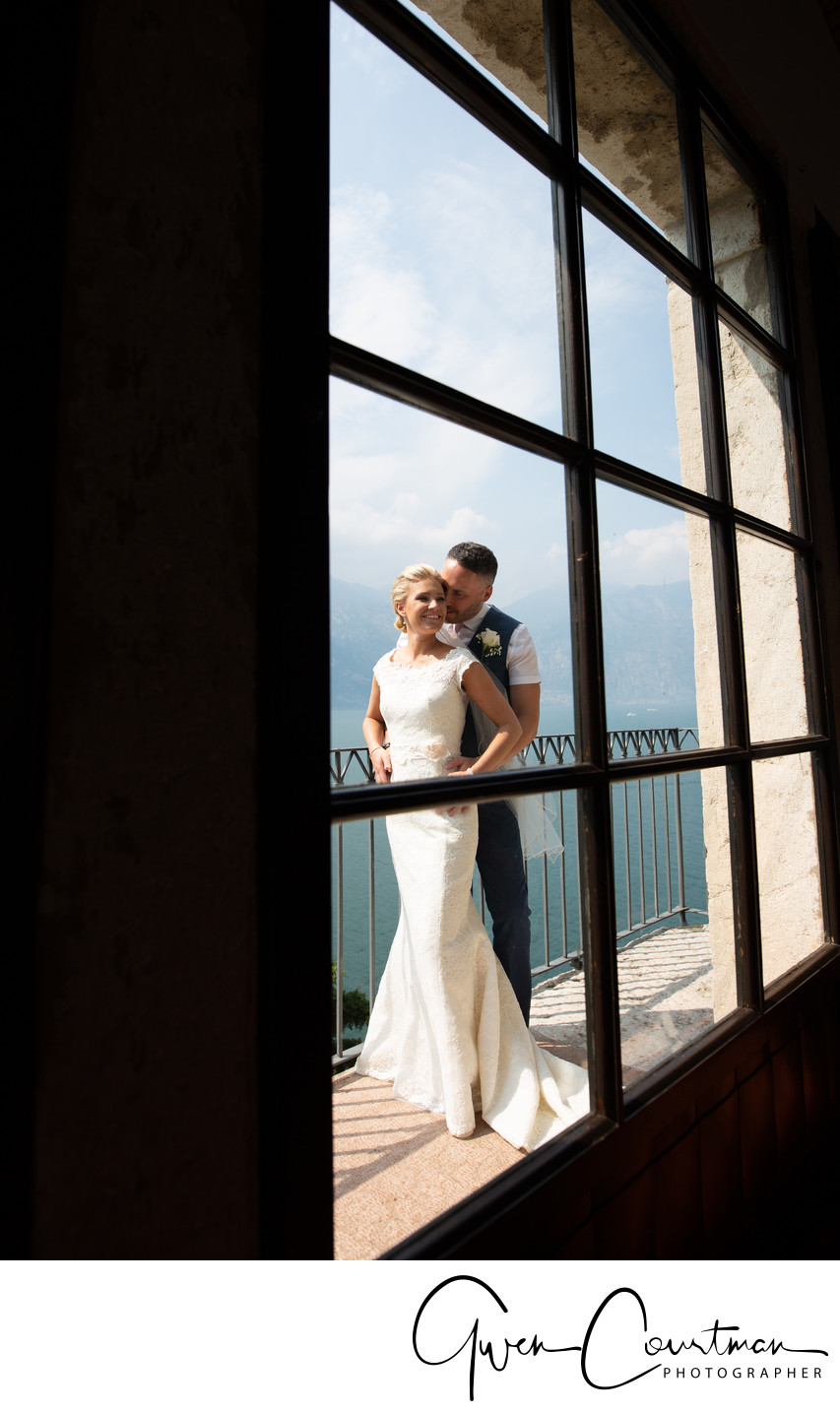 Bride and Groom in a window, Malcesine Castle, Italy