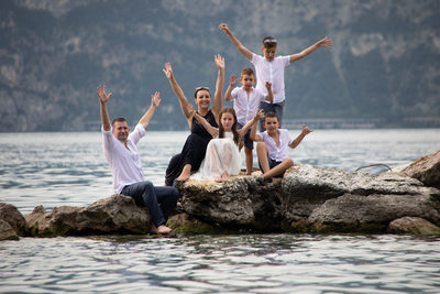 Fun family trash the dress and wedding in Malcesine