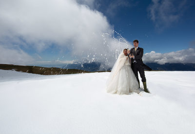 Trash the dress in the snow with bubbly, Italy