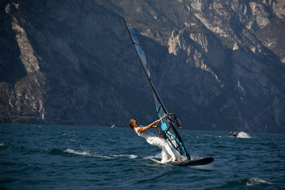 Trash the dress on a windsurf, Lake Garda.