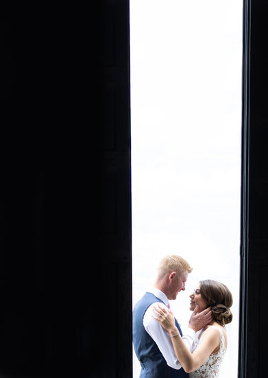 Bride and groom in a doorway. Malcesine, Lake Garda, IT