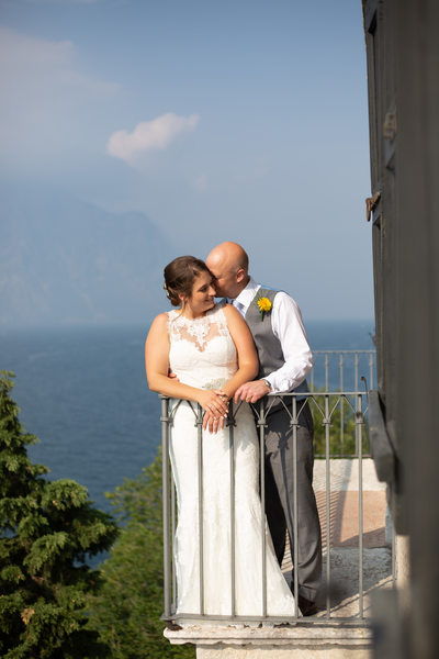 Wedding moments in Malcesine Castle  on the balcony.