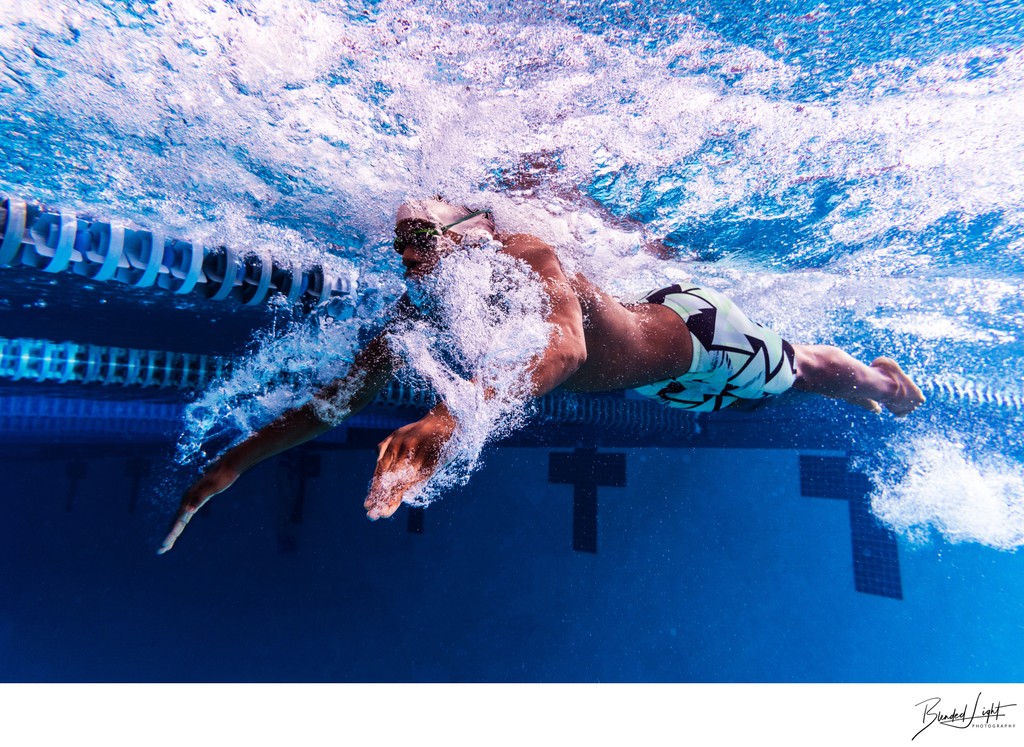 Underwater image of butterfly stroke with local swimmer