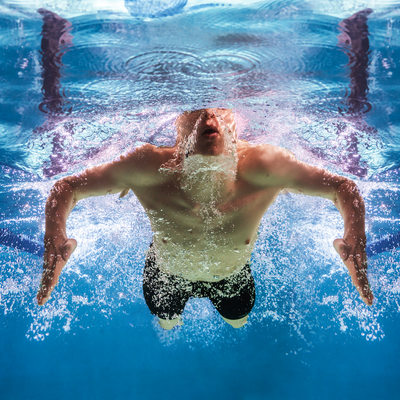 Breaststroke swimmer in perfect symmetry underwater pic