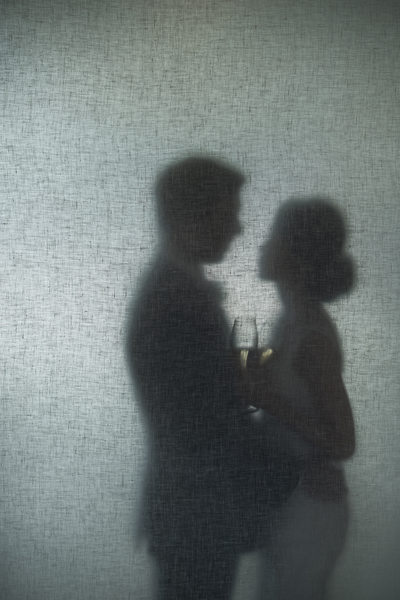 Silhouette of Couple with Champagne Glasses