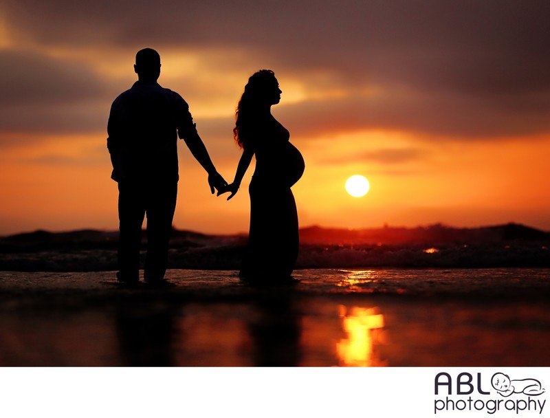 Silhouette beach maternity photo shoot