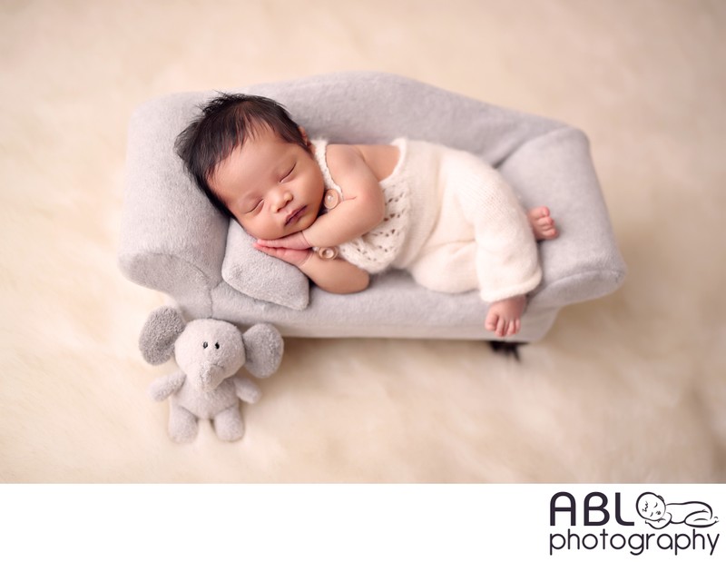  baby boy on gray little sofa