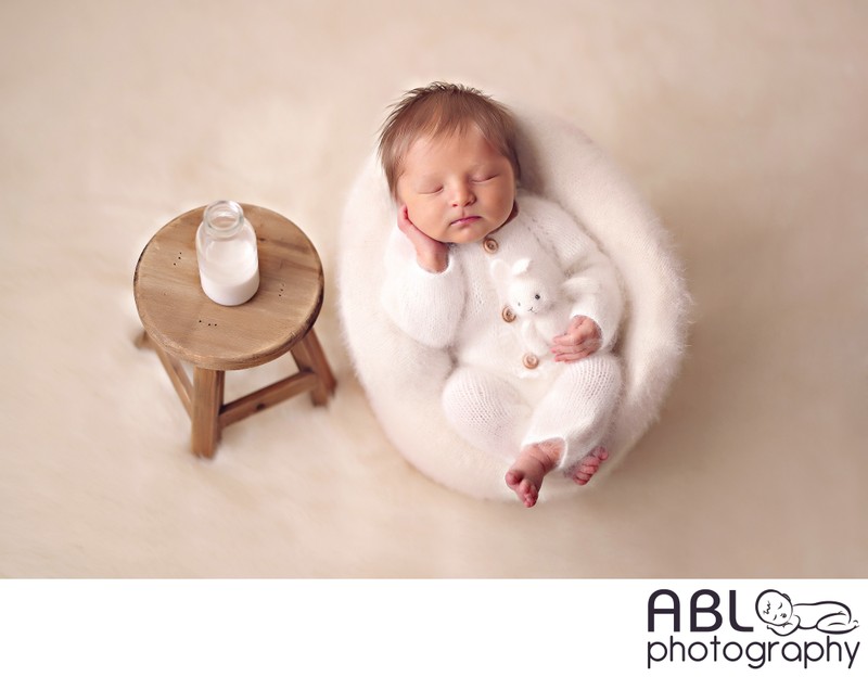 Baby in chair with milk, newborn photographer Poway, CA