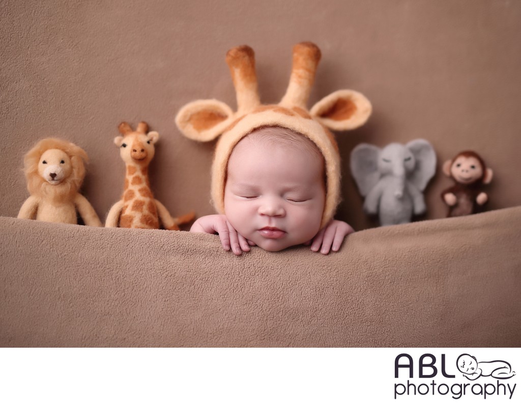 Newborn baby in giraffe costume