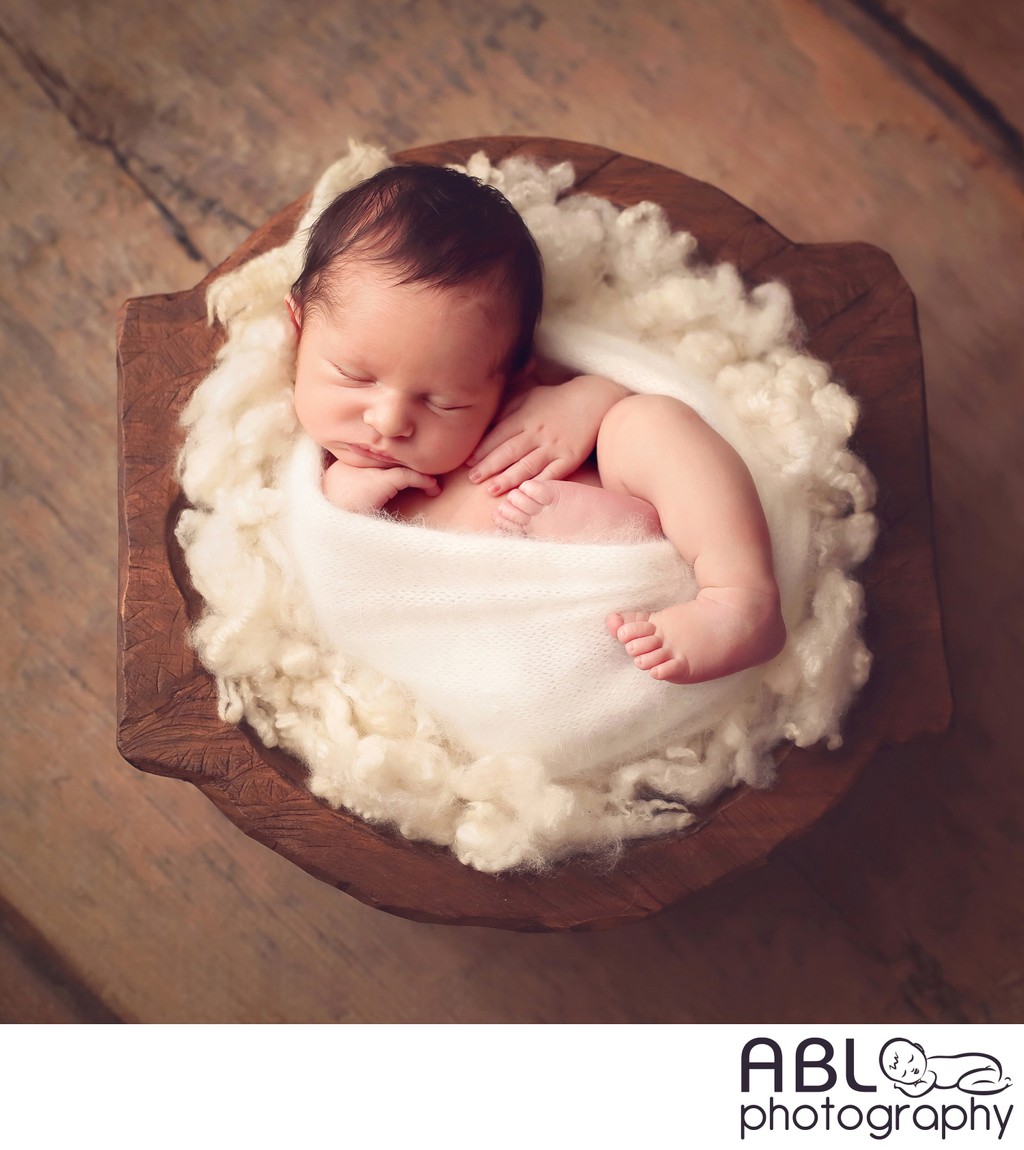 infant boy asleep in wooden bowl, La Jolla photographer