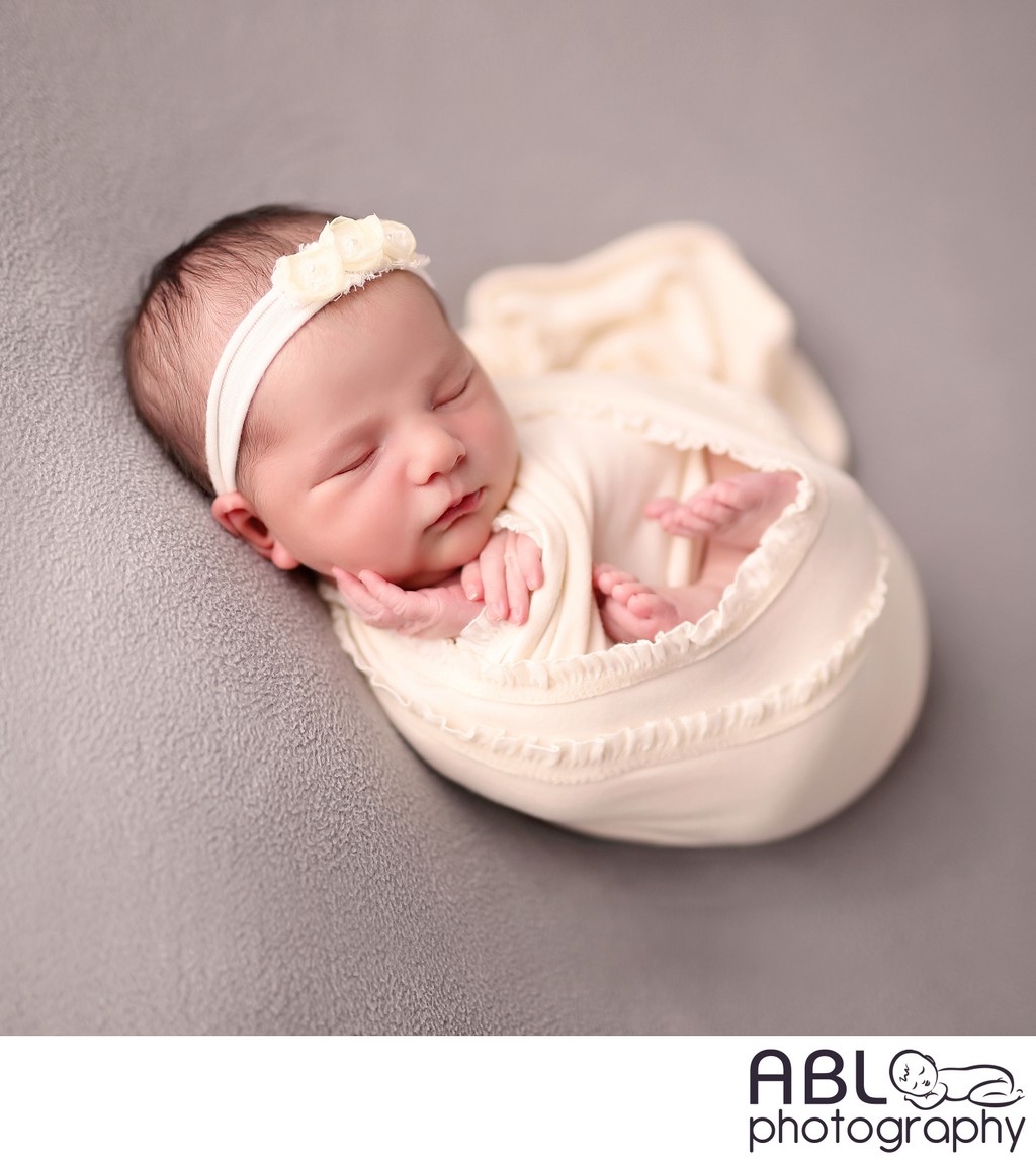 baby wrapped on gray, newborn photographer Chula Vista