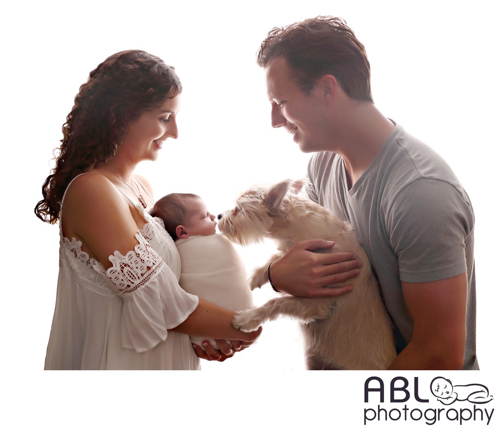 Extended family with dog and newborn baby