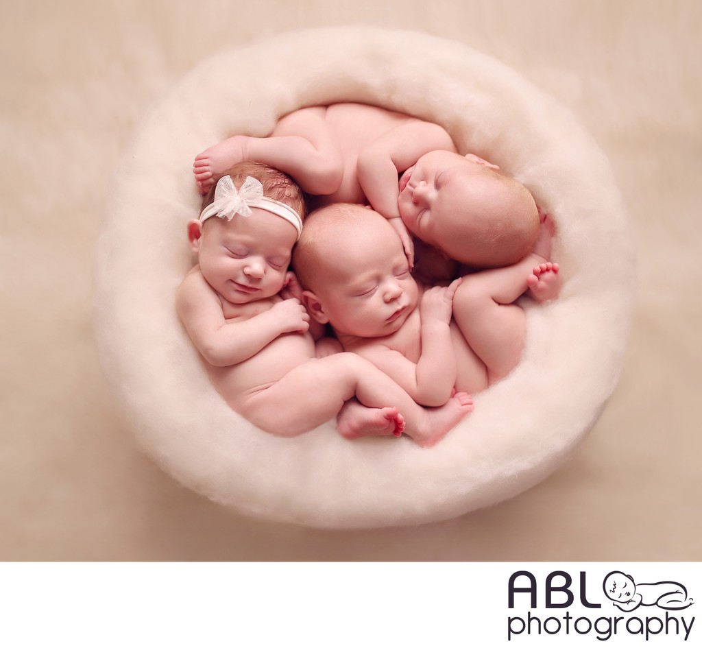 San Diego triplets newborn photography in cream nest 