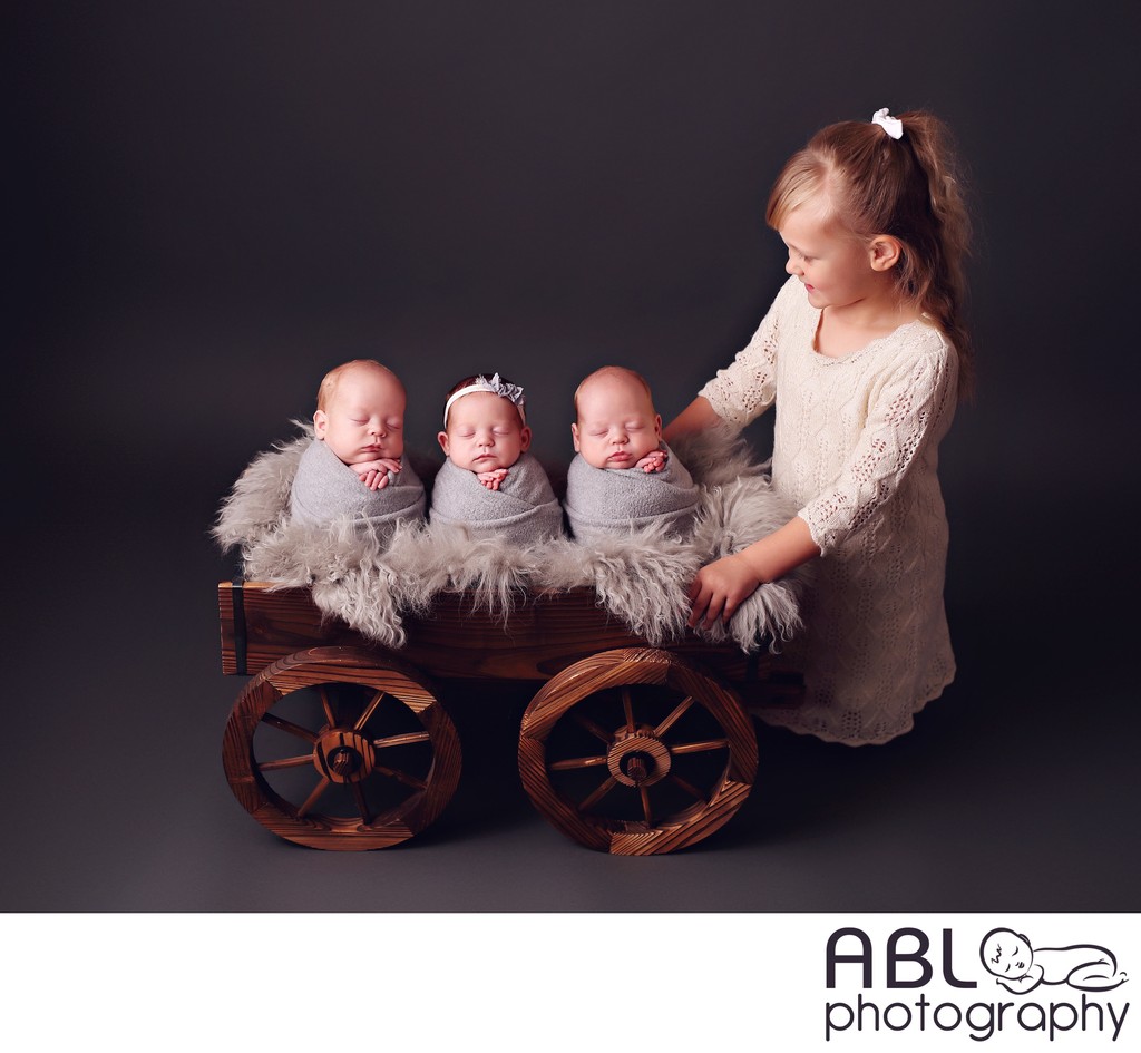 Newborn photos with older siblings triplets photo shoot
