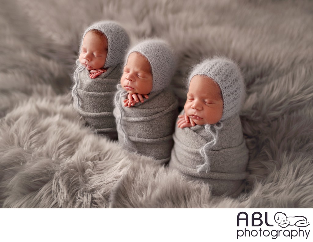 Triplet newborn photography posing idea in San Diego CA