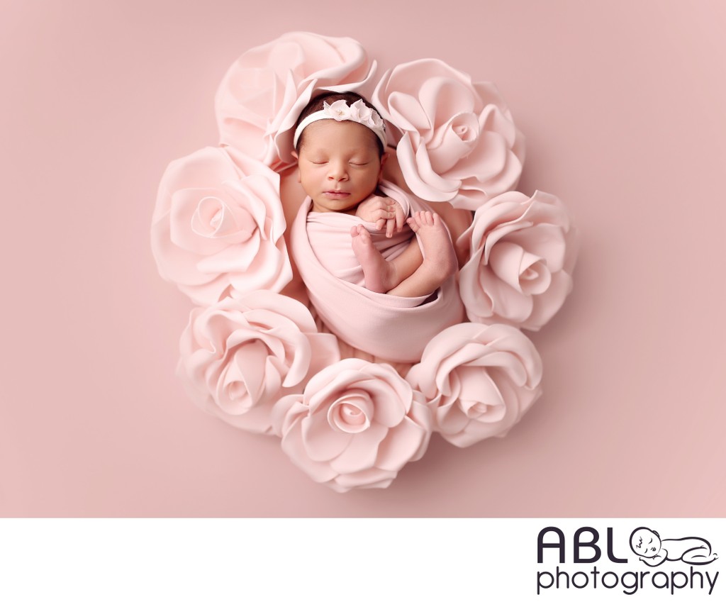 baby girl in pink flower 