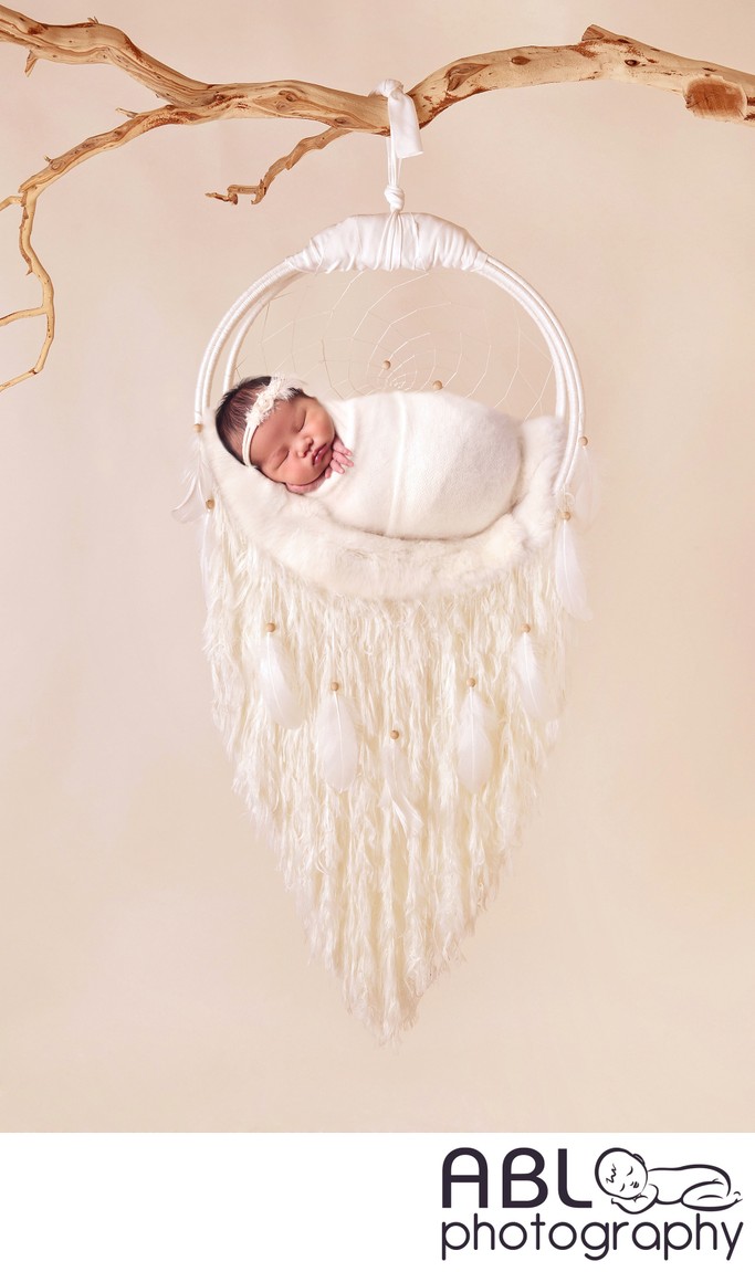Baby hanging in dream catcher