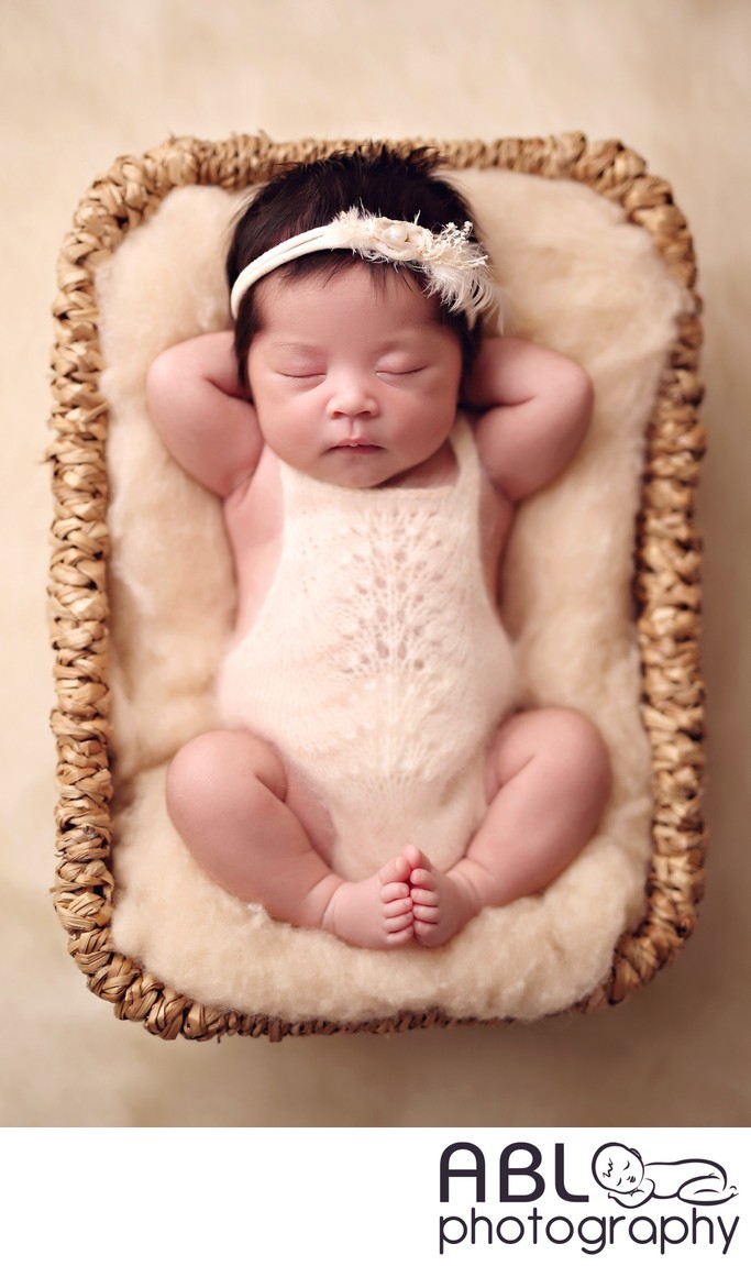 Newborn sleeping in basket
