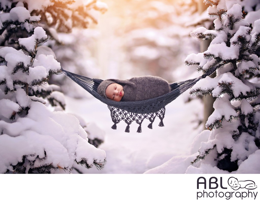 Newborn in hammock in winter