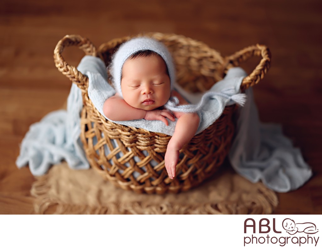 San Diego newborn photography baby boy posed in basket