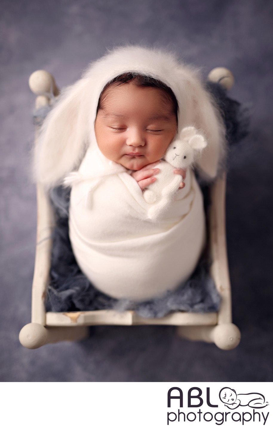 Newborn baby with fluffy bunny hat