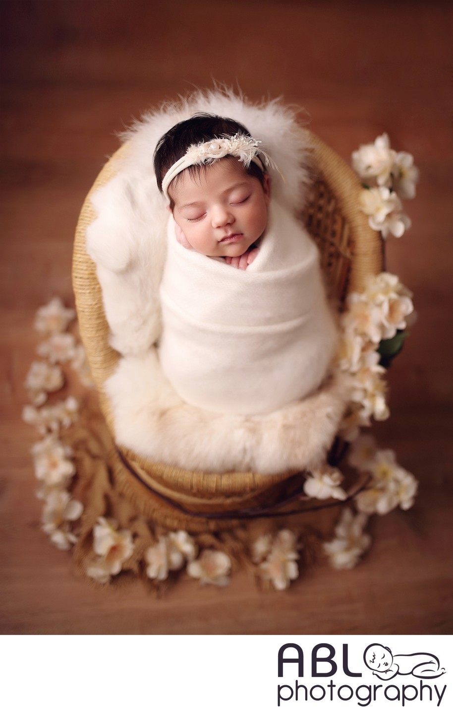 baby girl in cream angora wrap