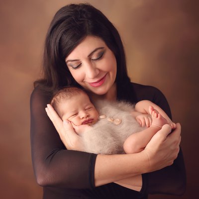 San Diego family photography with mom holding newborn