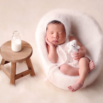 La Jolla infant photographer, baby in chair with milk