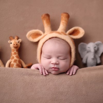 Newborn baby in giraffe costume