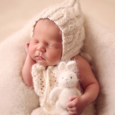 Del Mar newborn photo studio, baby holding stuffed toy