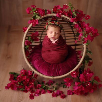 Indian baby girl wrapped in red