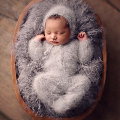 Baby in gray fluffy outfit