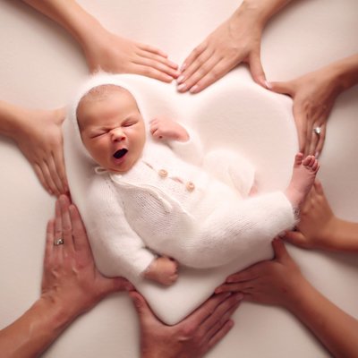 Newborn photo shoot ideas. Baby in the heart bowl.