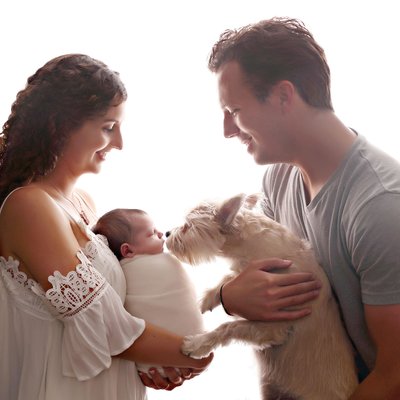 Extended family with dog and newborn baby