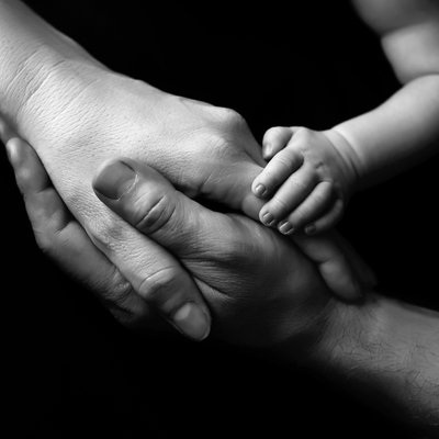 Parents and baby hands