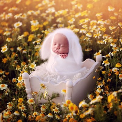 Outdoor newborn picture with flowers