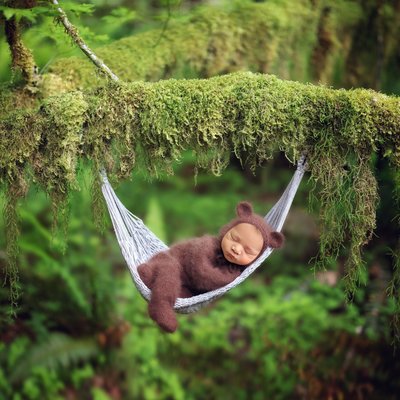 Newborn photos in San Diego. Baby in mossy hammock.