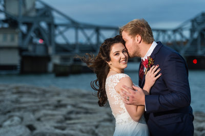 Sturgeon Bay wedding bride and groom portrait with bridge at dusk