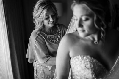 Bridal Prep - Mother lacing up the back of her dress